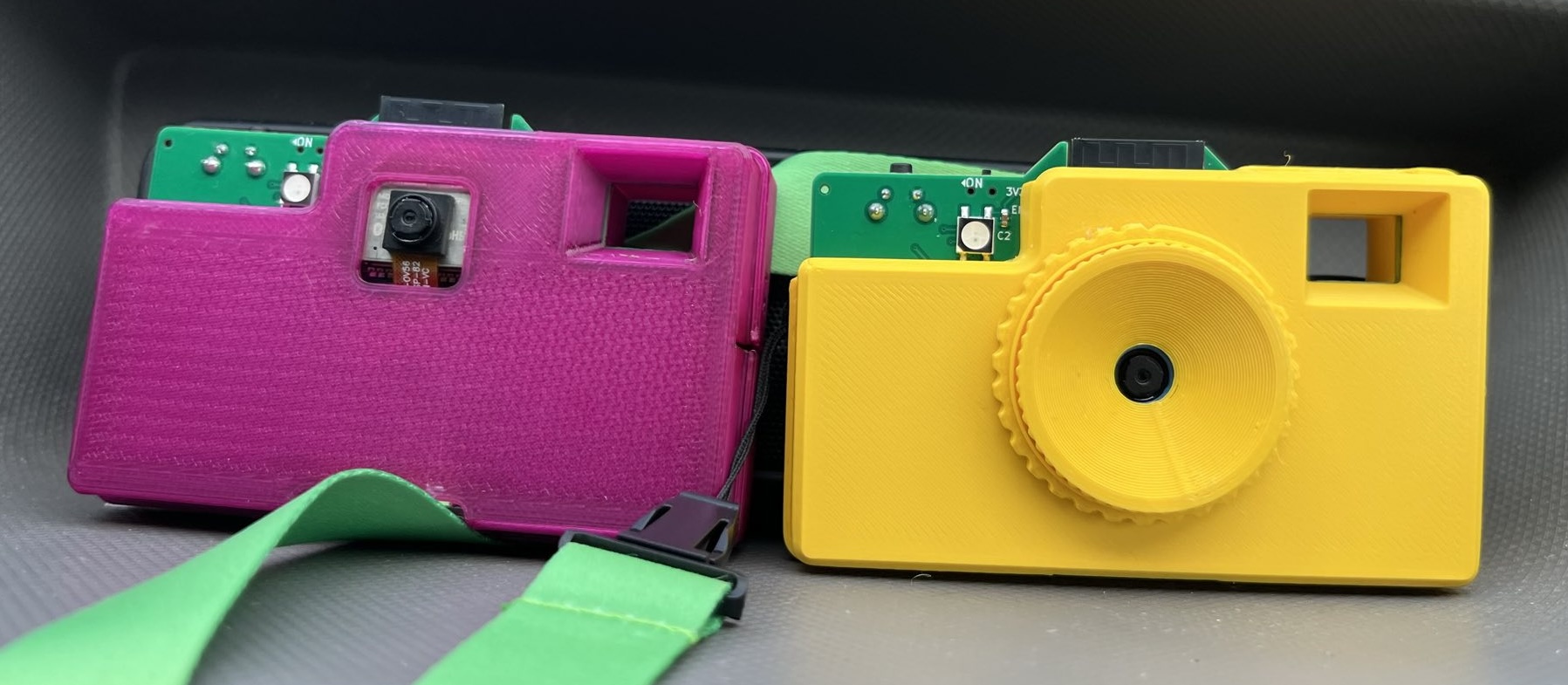 Crappy Camp Cam. 2 3D printed cases looking like cameras.