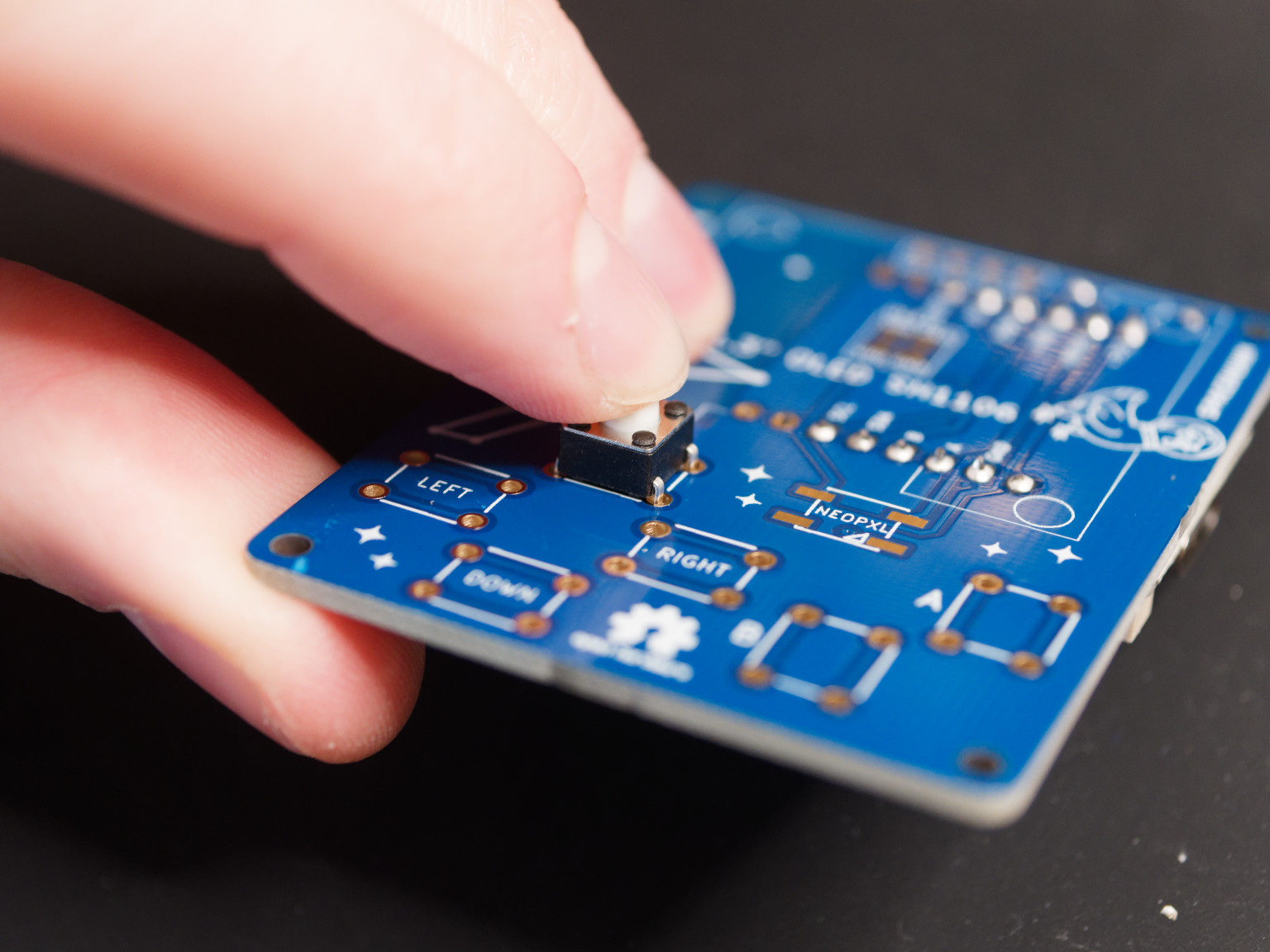 Pressing button onto HackHeld PCB