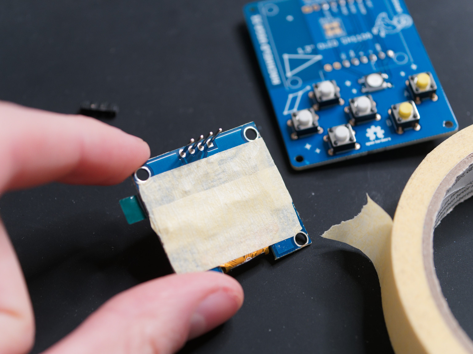 Adding tape to OLED display