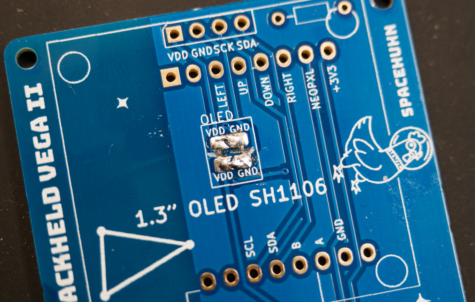 Soldered jumper bridges on HackHeld PCB