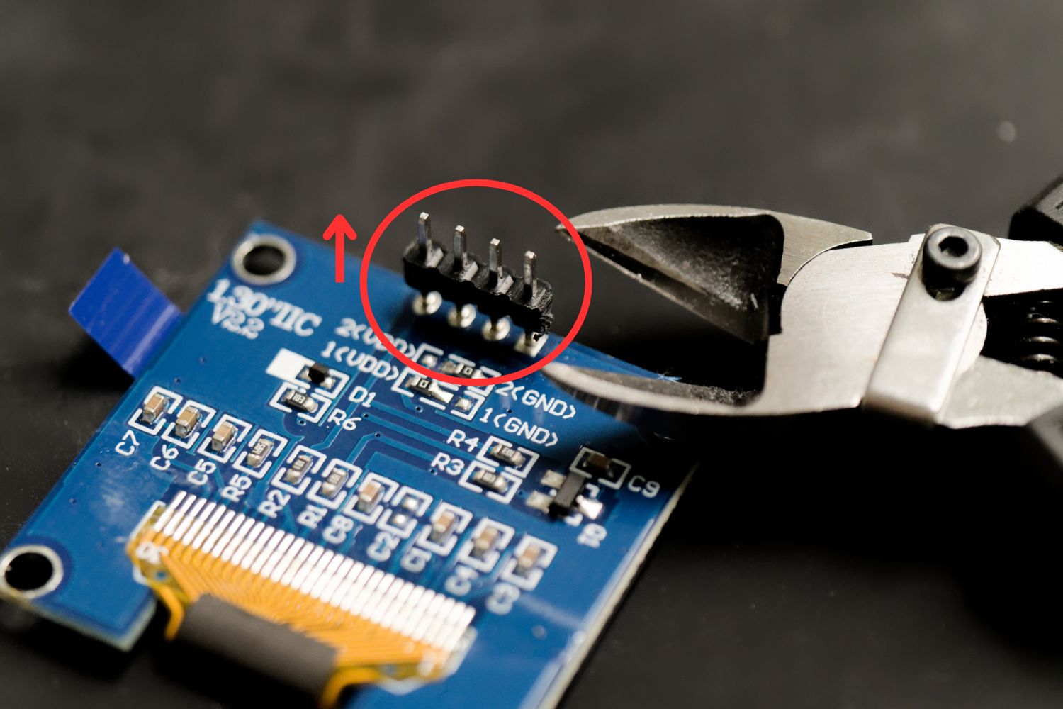 Removing plastic part from headers of OLED display