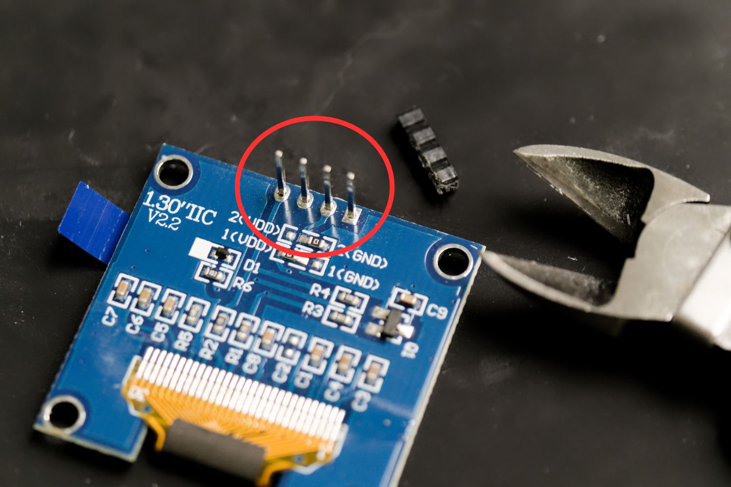 Removing plastic part from headers of OLED display