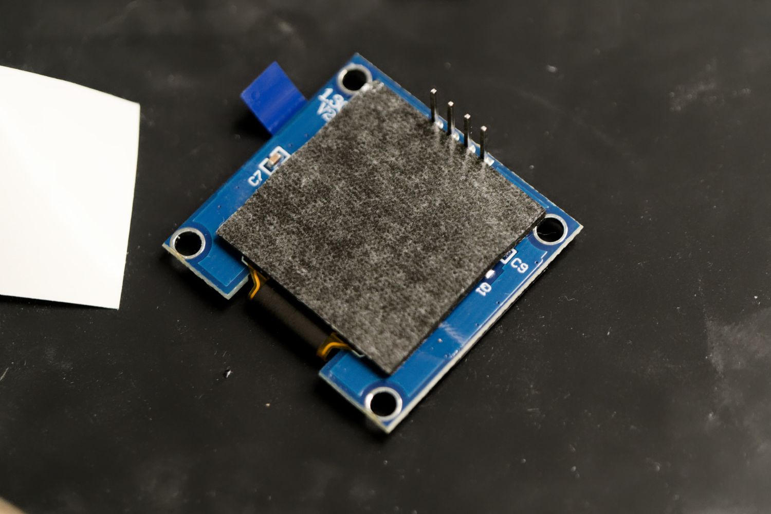 Adding adhesive to OLED display